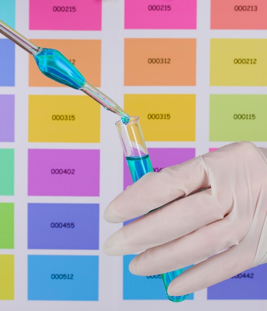 A lab technician analyzing a DNA sample with colorful charts and graphs in the background, representing genetic data analysis.