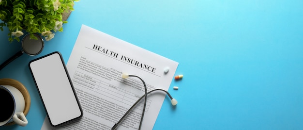 A close-up of an open health insurance policy document, highlighting sections about 