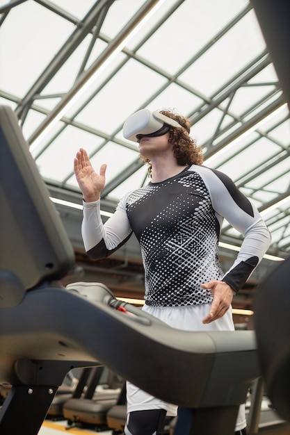 A person wearing fitness clothes and using a treadmill indoors. The focus is on their legs and the treadmill display, showing a brisk pace. The setting is a bright and modern home gym, emphasizing convenience and adaptability of walking as exercise.