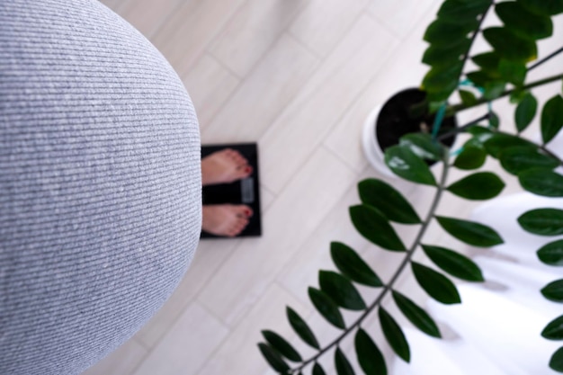 A minimalist meditation space with a cushion, a small plant, and soft lighting. The room is clean and uncluttered, creating a sense of tranquility and peace. The focus is on simplicity and creating a distraction-free environment.