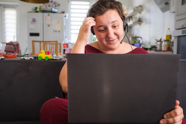 A person looking overwhelmed by numerous open tabs on a computer screen, representing information overload and digital anxiety.