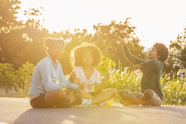 A diverse group of people enjoying outdoor activities under the sun, illustrating the natural source of vitamin D and its positive impact on overall health and well-being.