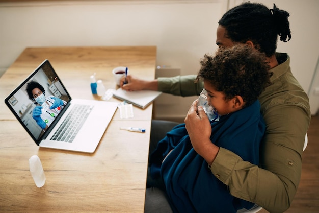 A primary care physician conducting a telehealth appointment with a patient. The physician is smiling and engaged, while the patient appears comfortable and relaxed in their home setting.