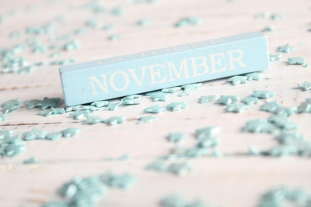 A close-up of a seasonal calendar highlighting the months of November, December, January, and February in a faded blue color, symbolizing the peak months for SAD.