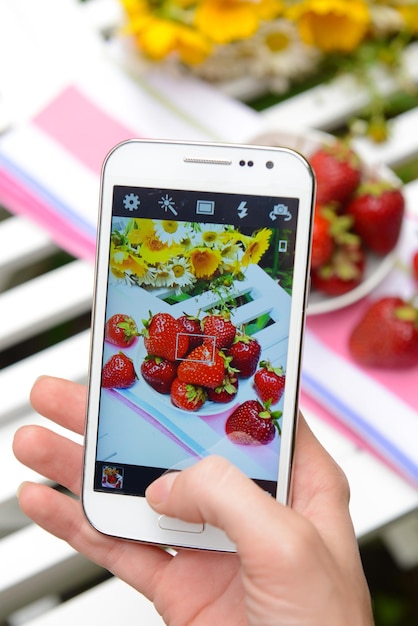 A close-up of a smartphone displaying various social media posts promoting different diets, with some posts featuring influencers and others showcasing dramatic before-and-after photos.